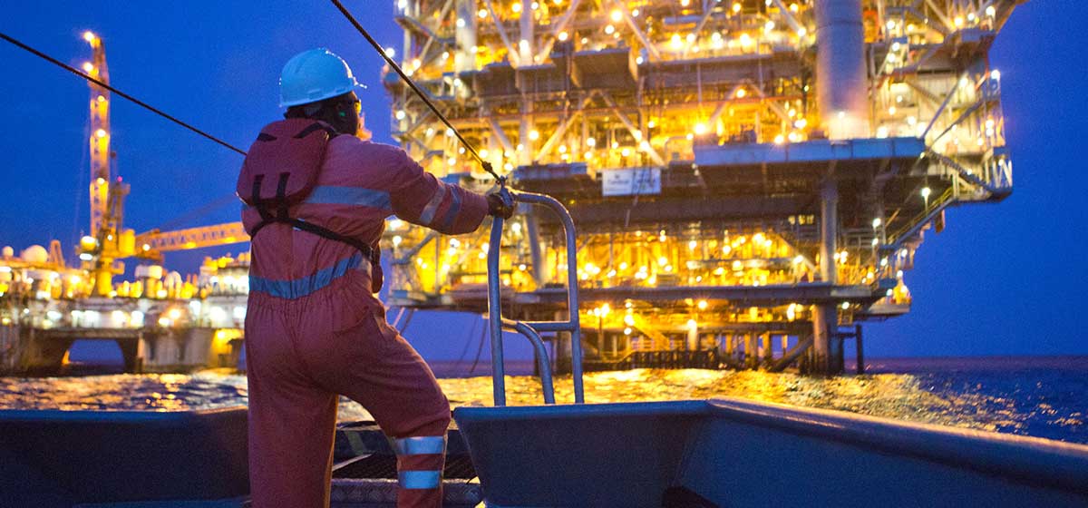Chevron worker looking at offshore platform