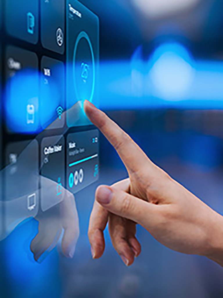 Close up of woman's hand setting up intelligent home system, controlling smart home appliances with control panel of a smart home.